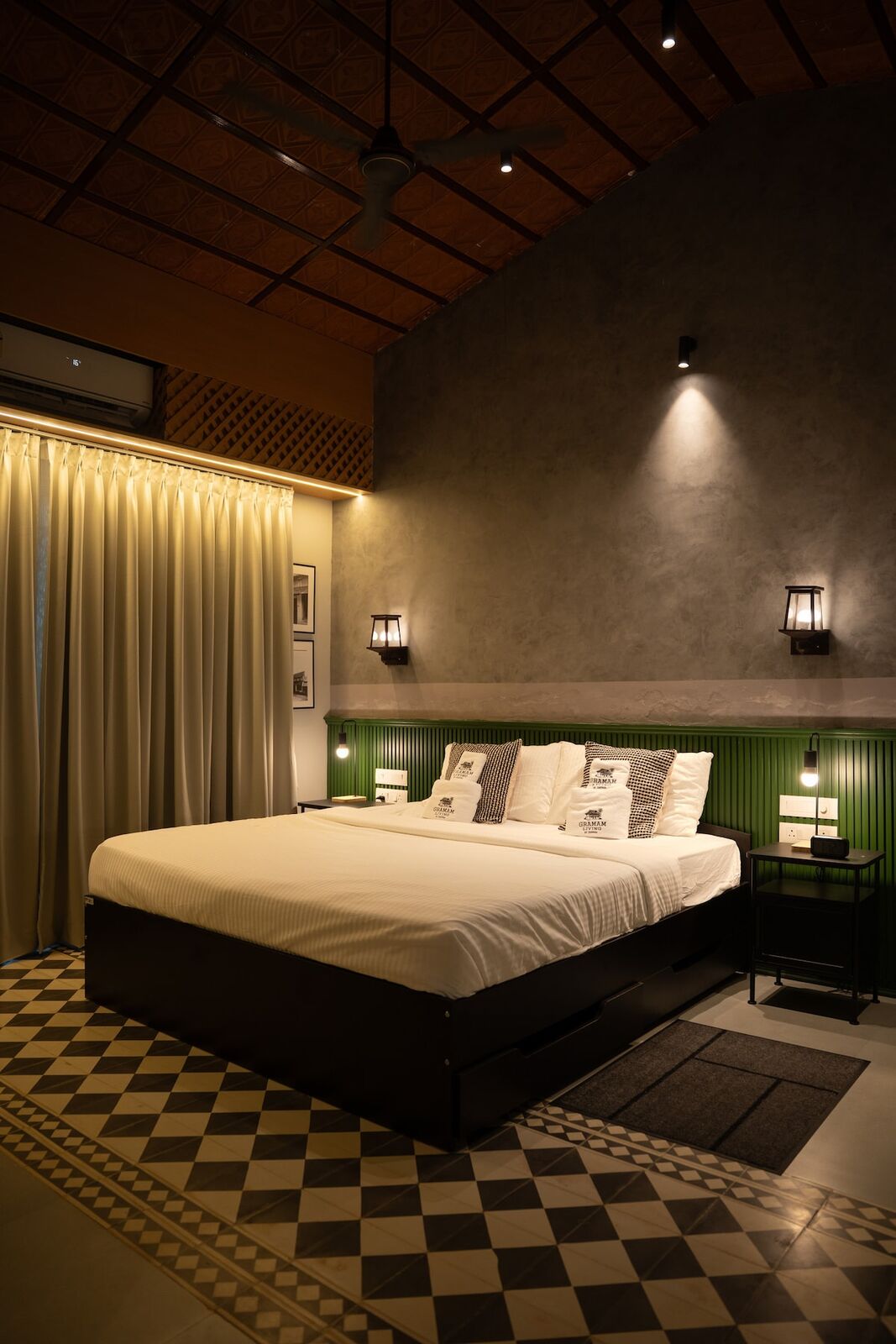 Bedroom three, a king bed on a chequered tile floor.